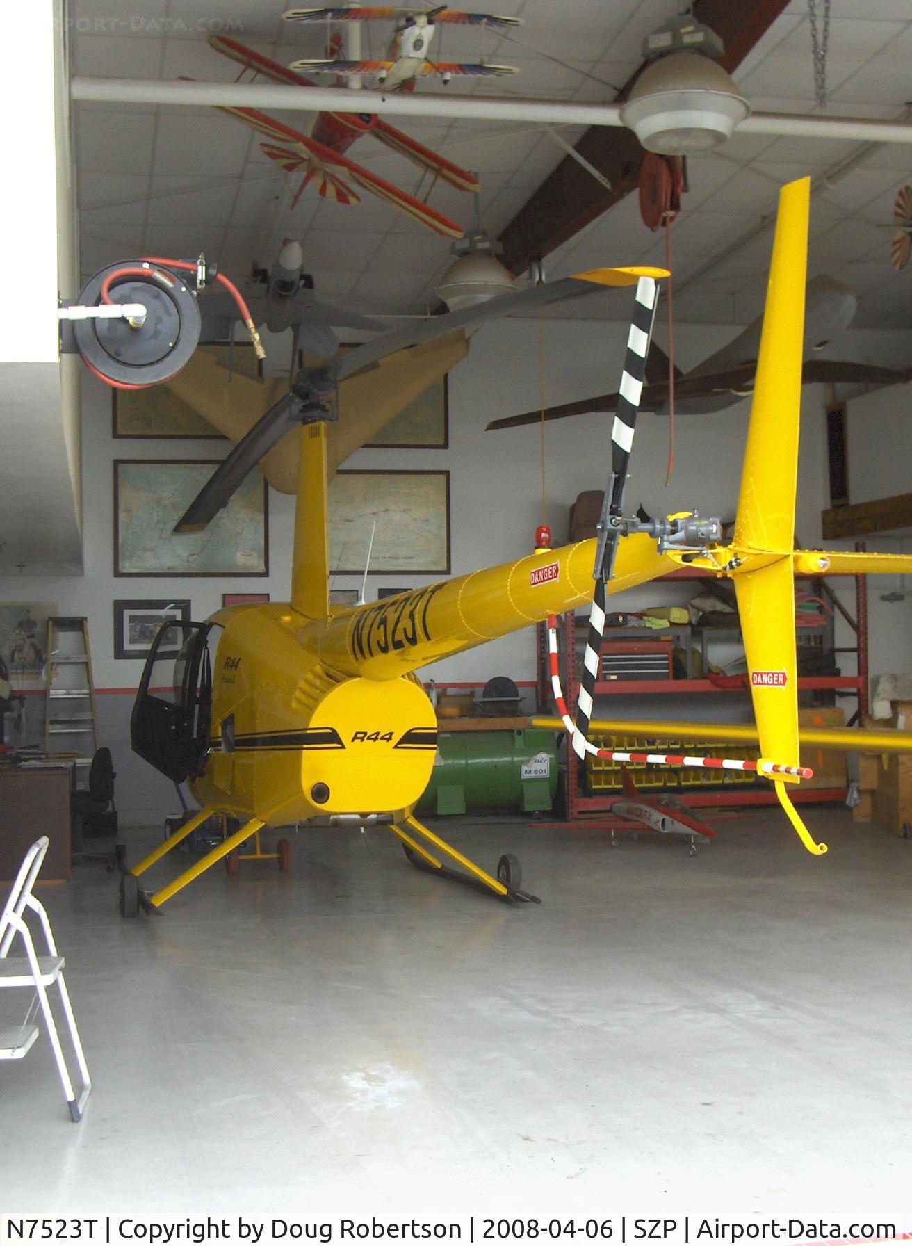 N7523T, 2004 Robinson R44 Raven II C/N 10311, 2004 Robinson R-44 RAVEN II, Lycoming IO-540 derated to 245 Hp for 5 minutes, 205 Hp continuous, in hangar