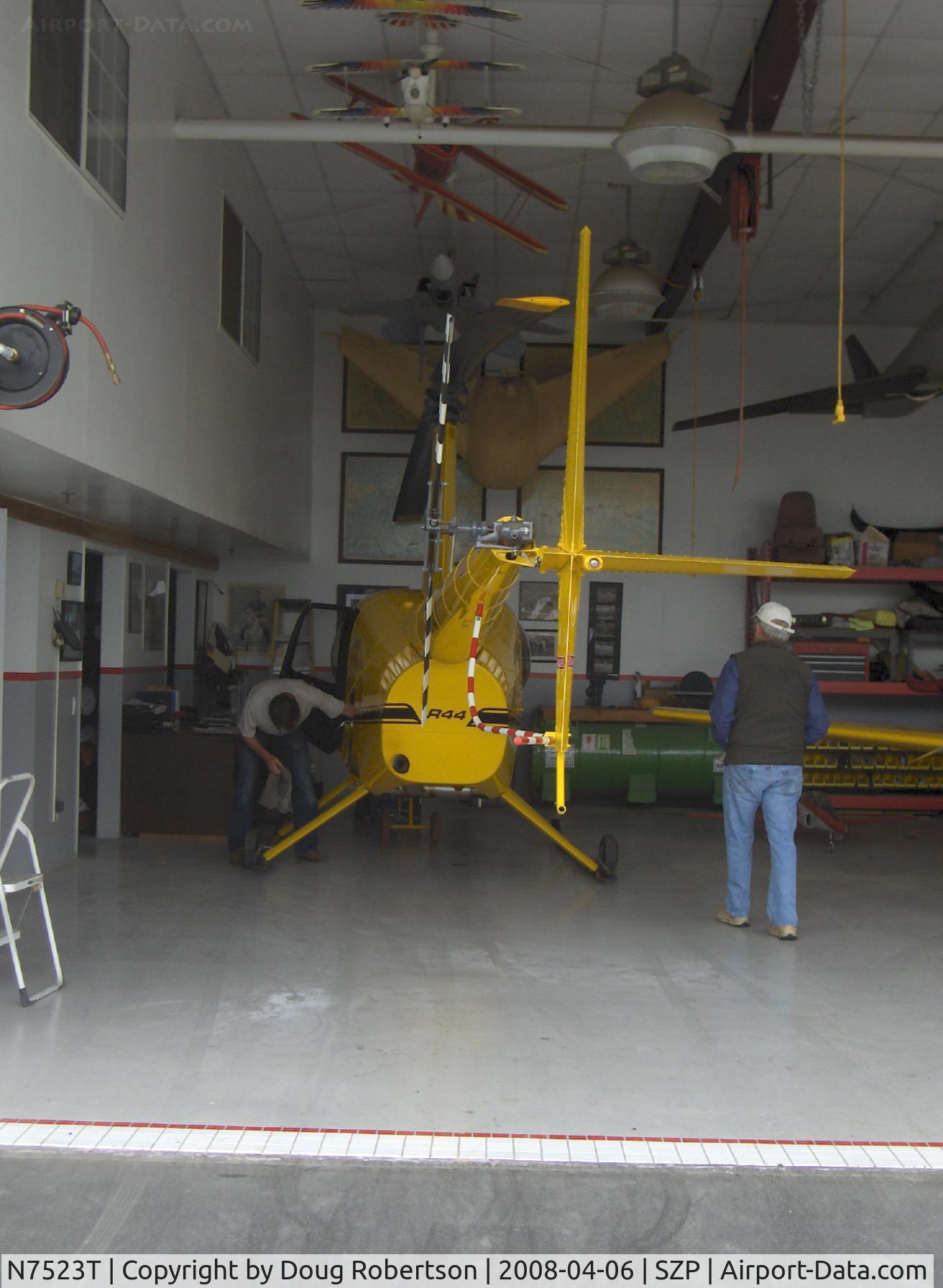 N7523T, 2004 Robinson R44 Raven II C/N 10311, 2004 Robinson R-44 RAVEN II, Lycoming IO-540 derated to 245 Hp for 5 minutes, 205 Hp continuous, in hangar