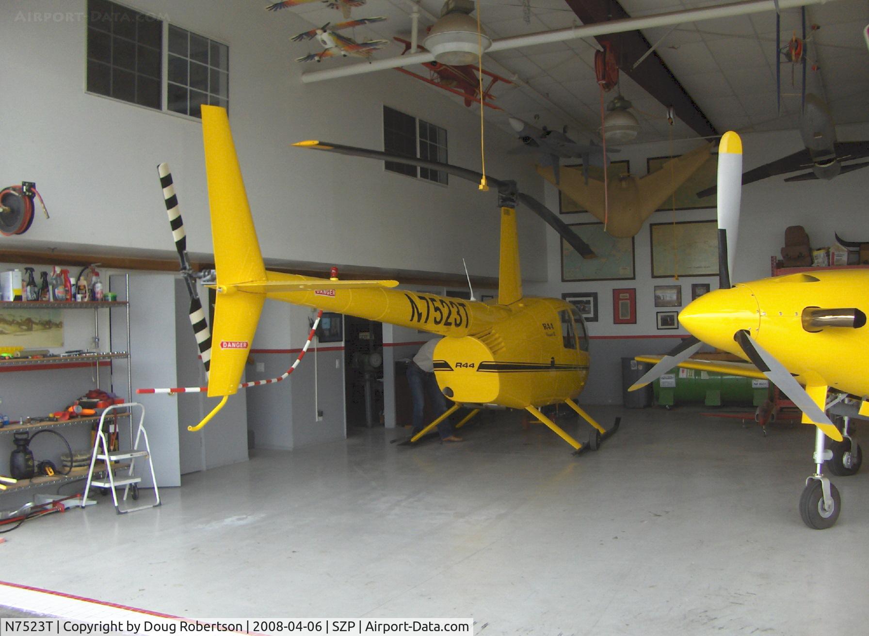 N7523T, 2004 Robinson R44 Raven II C/N 10311, 2004 Robinson R-44 RAVEN II, Lycoming IO-540 derated to 245 Hp for 5 minutes, 205 Hp continuous, in hangar