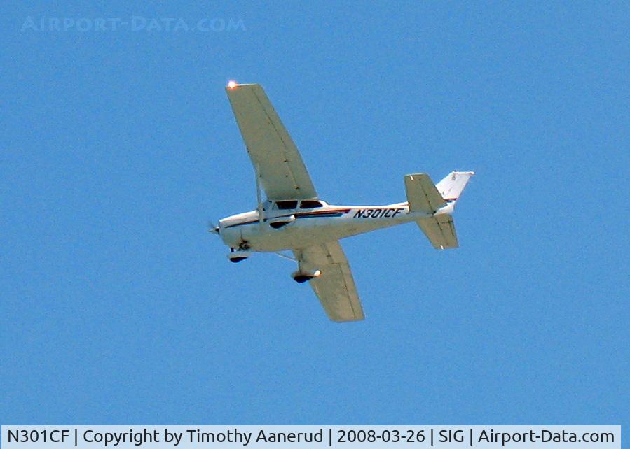 N301CF, 2002 Cessna 172R C/N 17281135, 2002 Cessna 172R Skyhawk, c/n 17281135, In the traffic pattern at SIG, taken from the beach/pool area from my hotel the Caribe Hilton