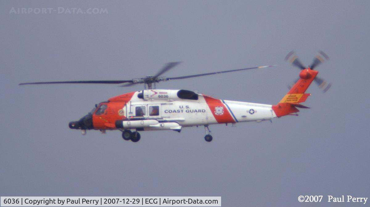 6036, Sikorsky MH-60J Jayhawk C/N 70.1957, A break in the clouds allows the vibrant USCG colors to pop