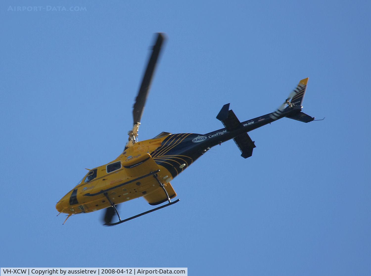VH-XCW, 1994 Bell 230 C/N 23019, Careflight Southbound over my place at the Gold Coast, wish they would use a bit more altitude as this thing shakes the house