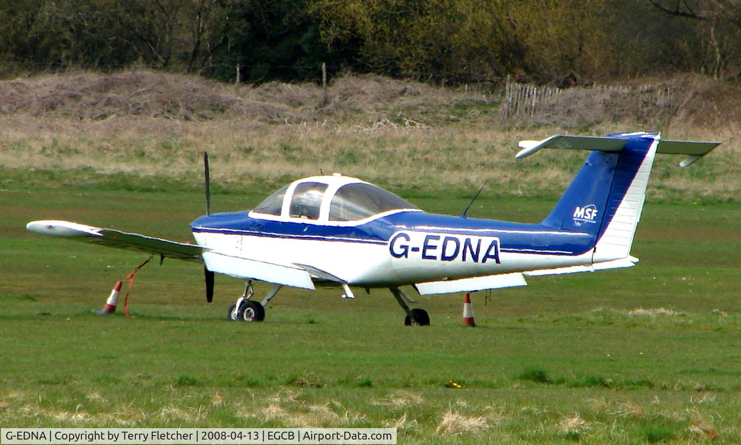 G-EDNA, 1978 Piper PA-38-112 Tomahawk Tomahawk C/N 38-78A0364, Piper Tomahawk parked remotely  at a waterlogged  Barton