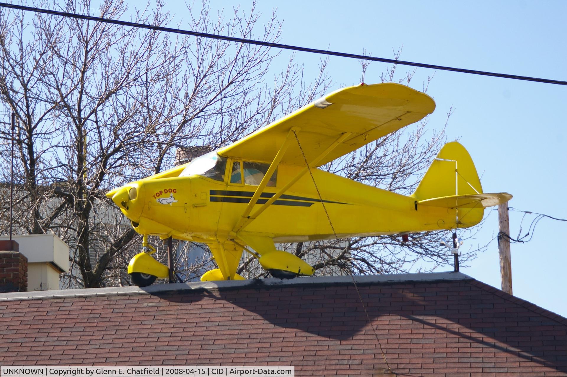 UNKNOWN, , Piper Colt on top of the Flying Weenie, downtown Cedar Rapids, IA.  Even the tables have sectional charts.  Lots of airplane stuff inside
