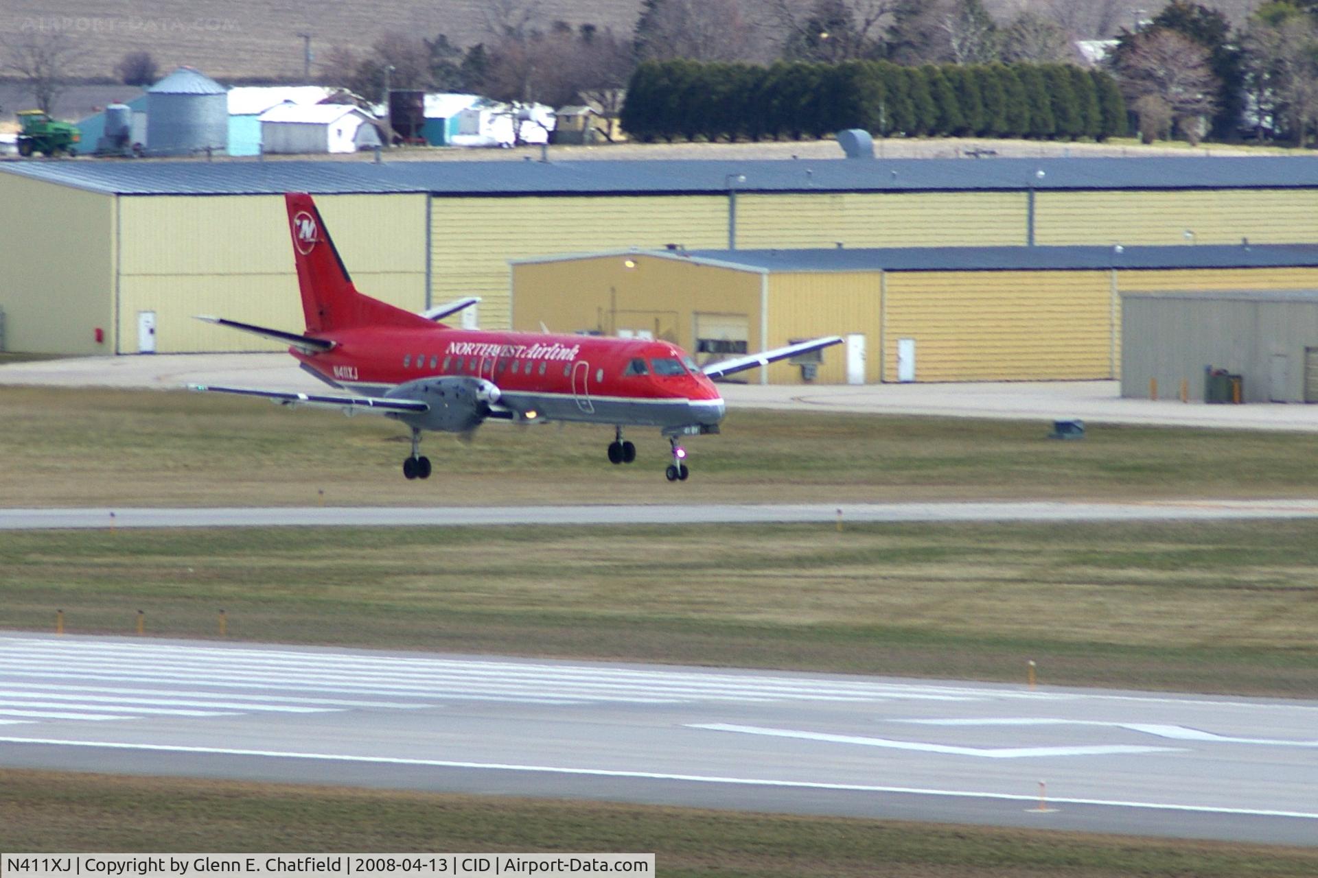 N411XJ, 1997 Saab 340B C/N 340B-411, About to cross over the numbers landing Runway 27