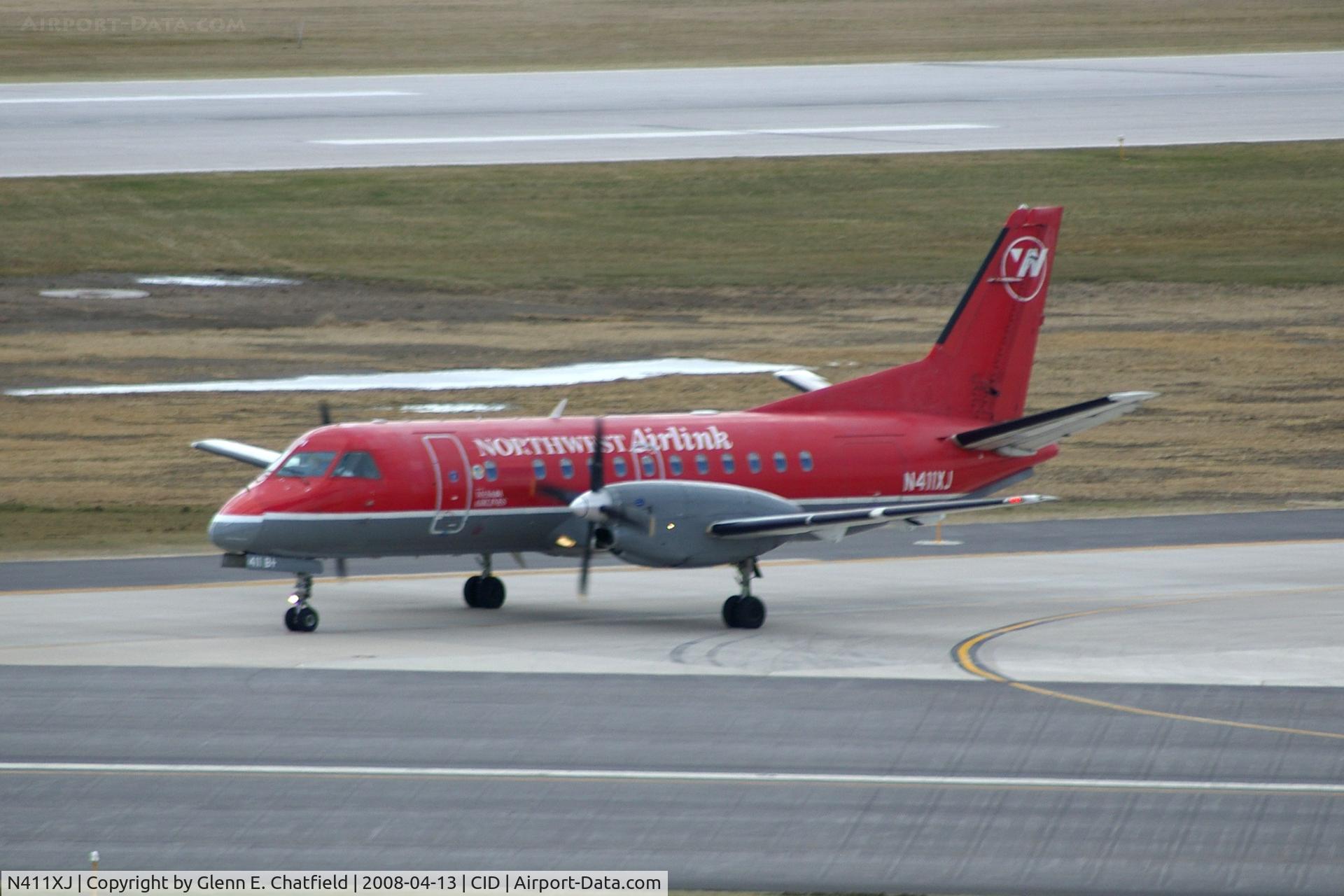 N411XJ, 1997 Saab 340B C/N 340B-411, Taxiing to the gate on Alpha.  I was trying to talk to airplanes at the same time and got a weeee bit of a blur