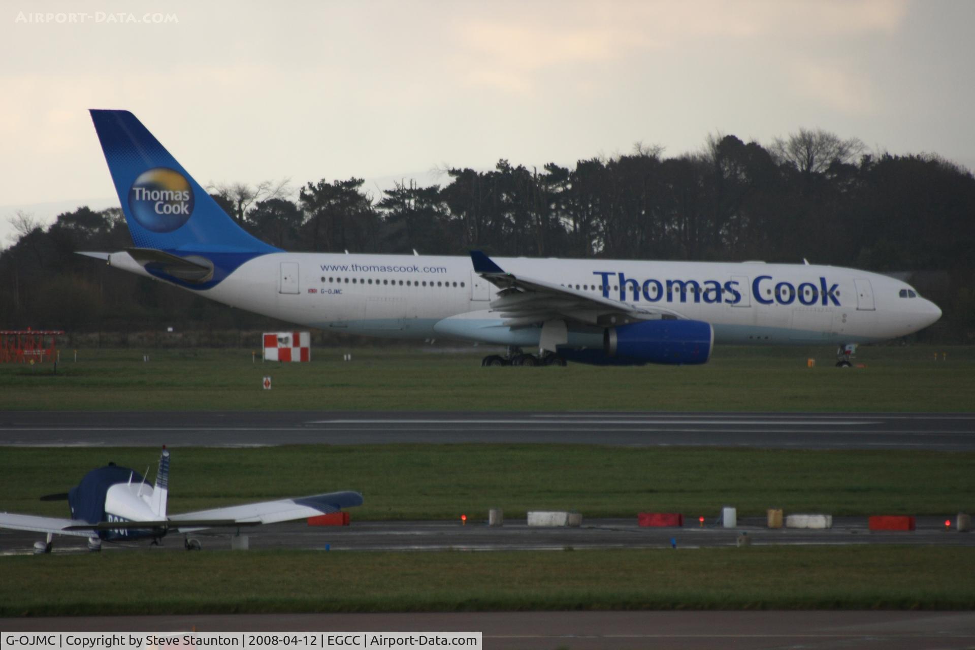 G-OJMC, 2002 Airbus A330-243 C/N 456, Taken at Manchester Airport on a typical showery April day