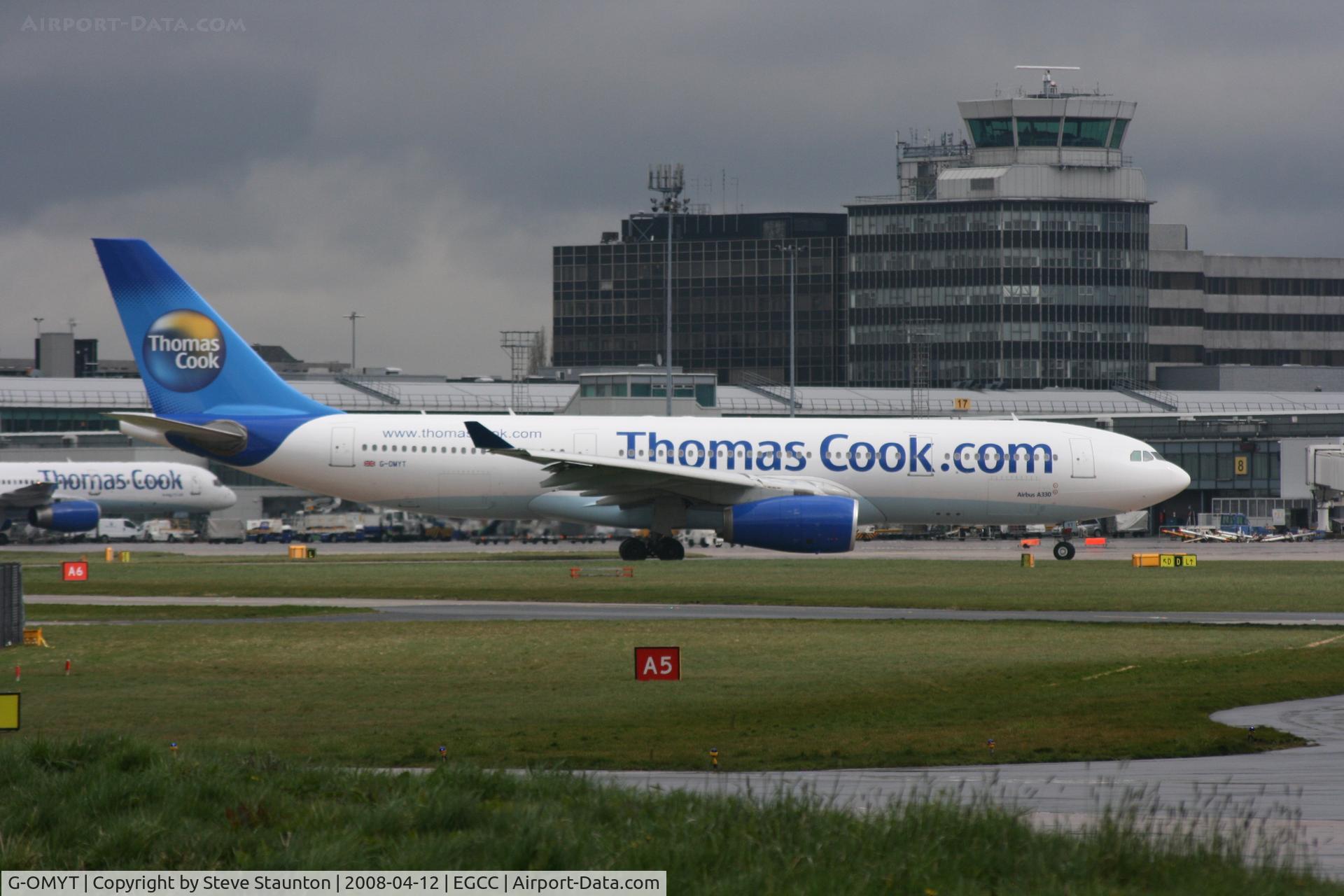 G-OMYT, 1999 Airbus A330-243 C/N 301, Taken at Manchester Airport on a typical showery April day