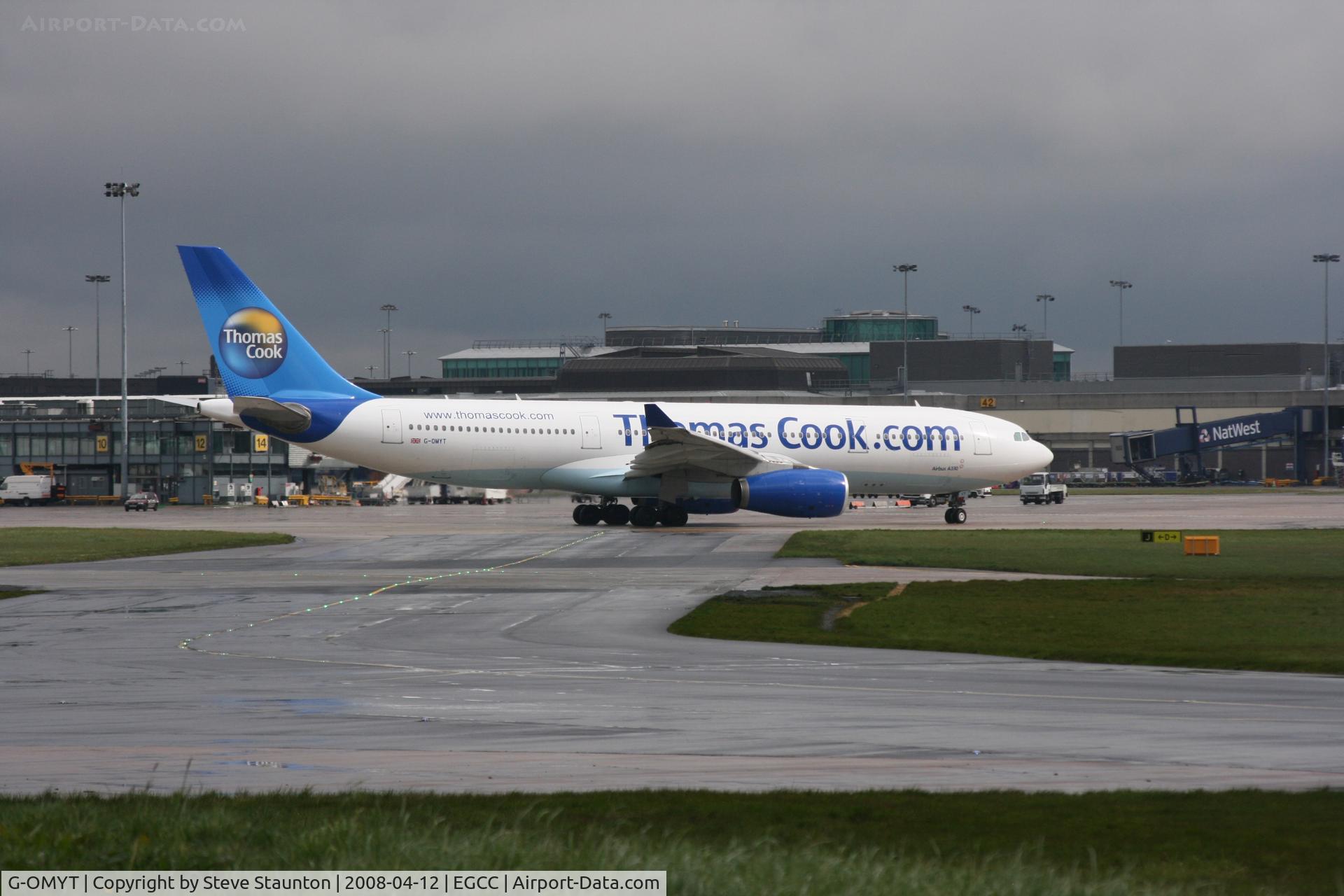 G-OMYT, 1999 Airbus A330-243 C/N 301, Taken at Manchester Airport on a typical showery April day