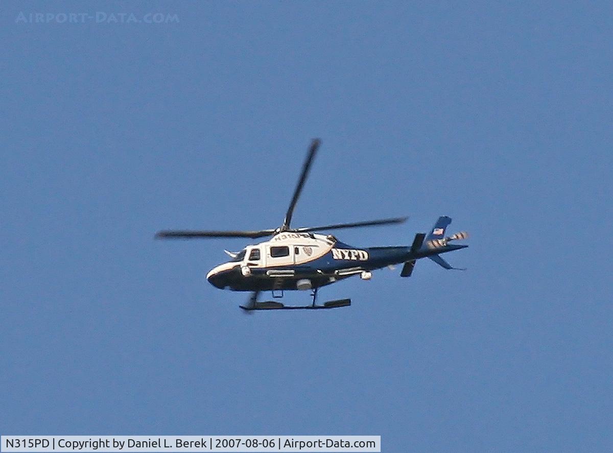 N315PD, 2003 Agusta AW-119 Mk.II C/N 14035, A NYPD chopper keeps check during the terrible fire at the old Deutsche Bank building.