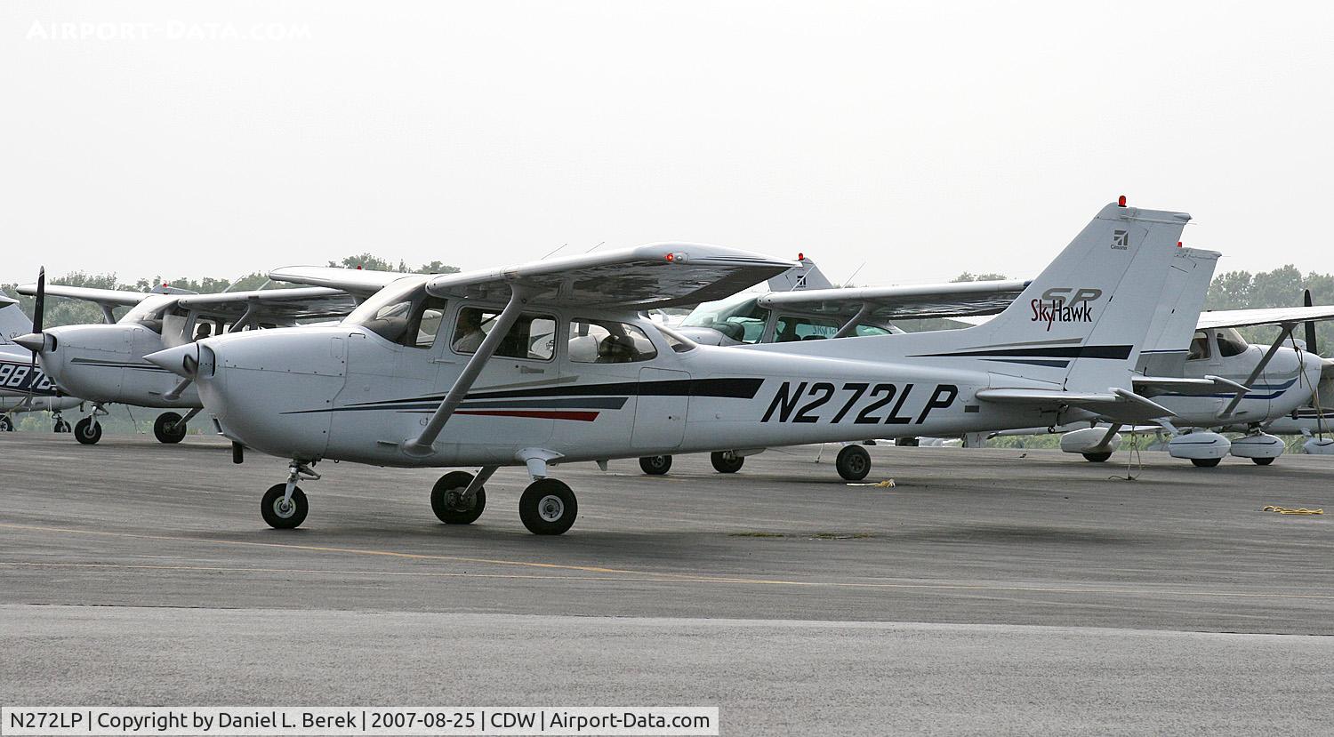 N272LP, 2002 Cessna 172S C/N 172S9272, Nice, new Skyhawk negotiates the crowded ramp at CDW.