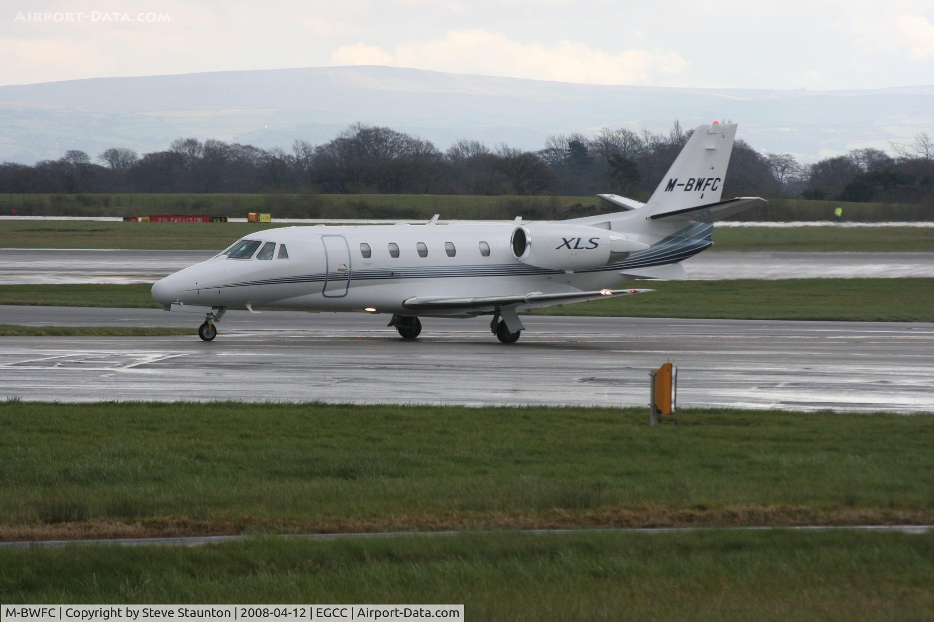 M-BWFC, Cessna 560XL Citation XLS C/N 560-5690, Taken at Manchester Airport on a typical showery April day