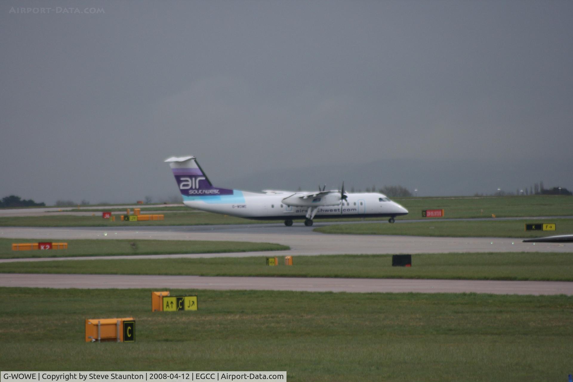 G-WOWE, 1991 De Havilland Canada DHC-8-311 Dash 8 C/N 256, Taken at Manchester Airport on a typical showery April day