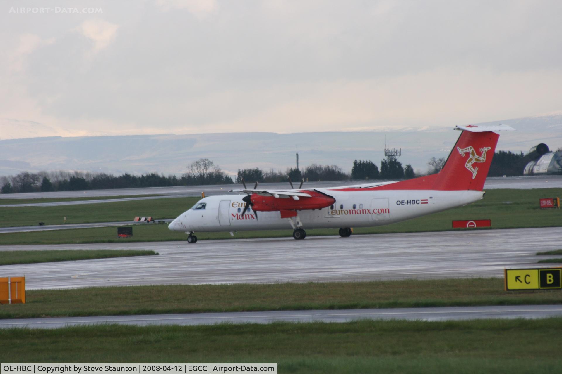 OE-HBC, 1999 De Havilland Canada DHC-8-311 Dash 8 C/N 533, Taken at Manchester Airport on a typical showery April day