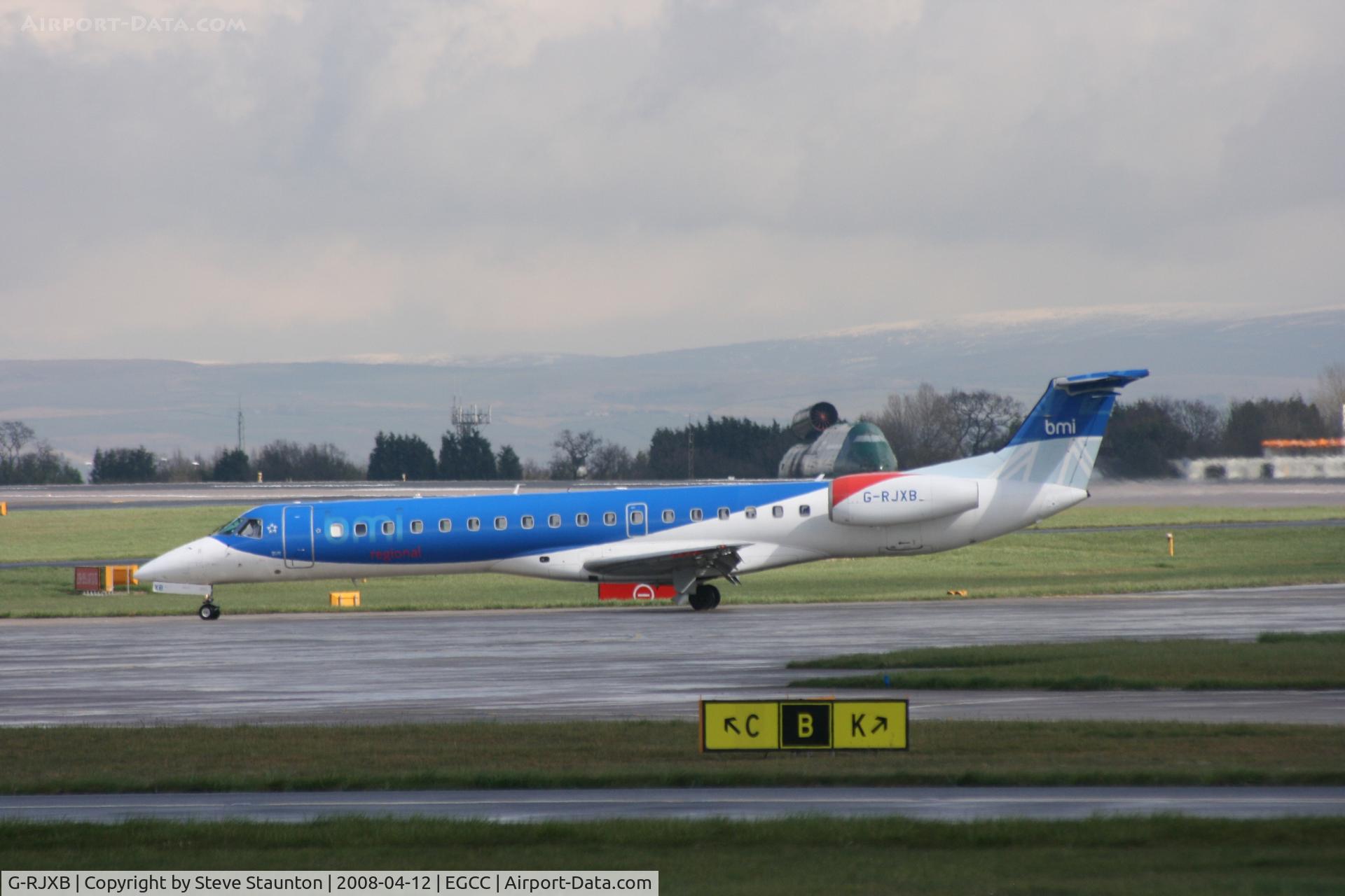 G-RJXB, 1999 Embraer EMB-145EP (ERJ-145EP) C/N 145142, Taken at Manchester Airport on a typical showery April day