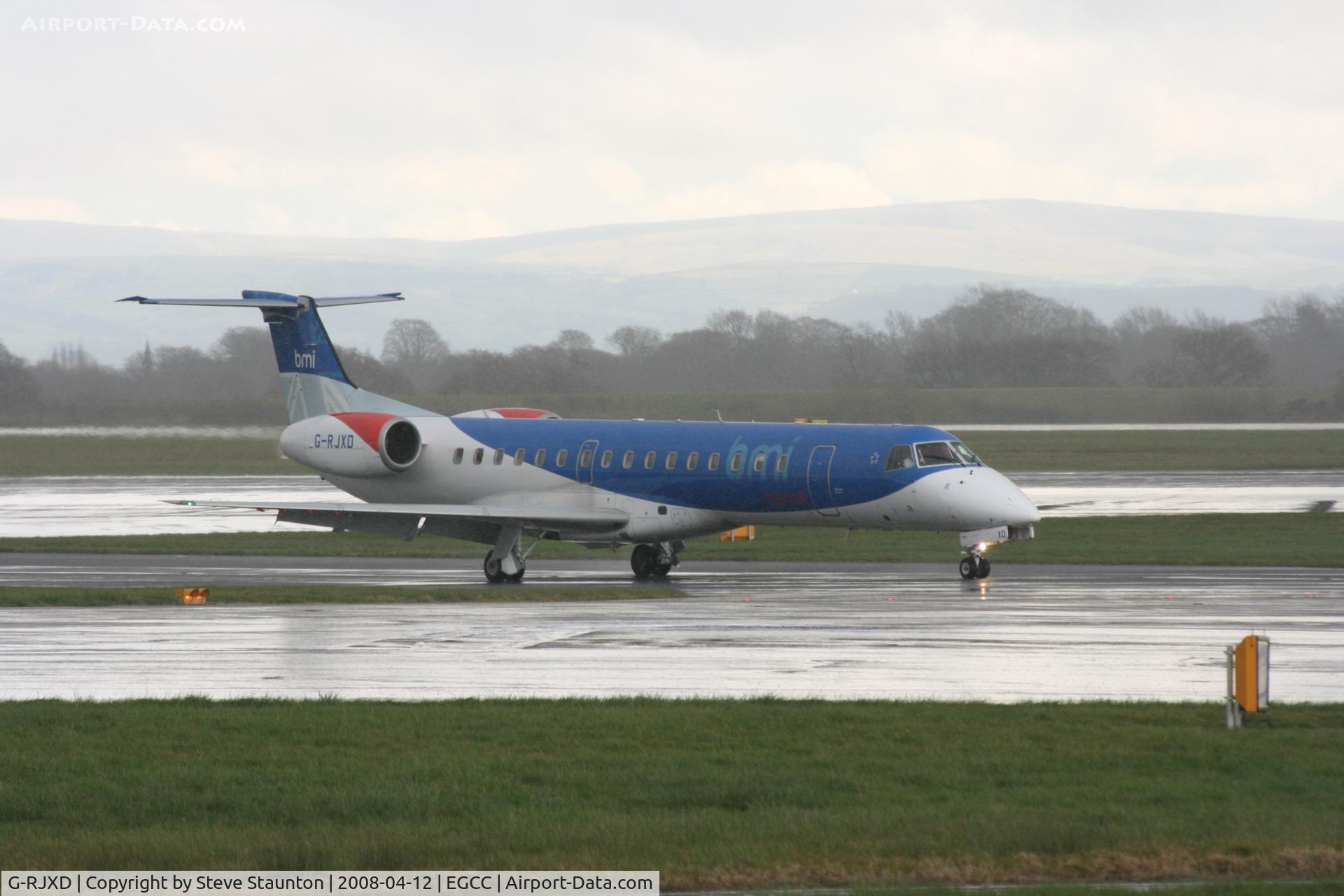 G-RJXD, 2000 Embraer EMB-145EP (ERJ-145EP) C/N 145207, Taken at Manchester Airport on a typical showery April day