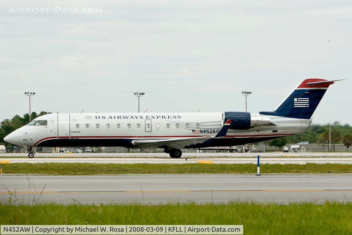 N452AW, 2003 Bombardier CRJ-200LR (CL-600-2B19) C/N 7835, Taxiing to runway 9L for departure.