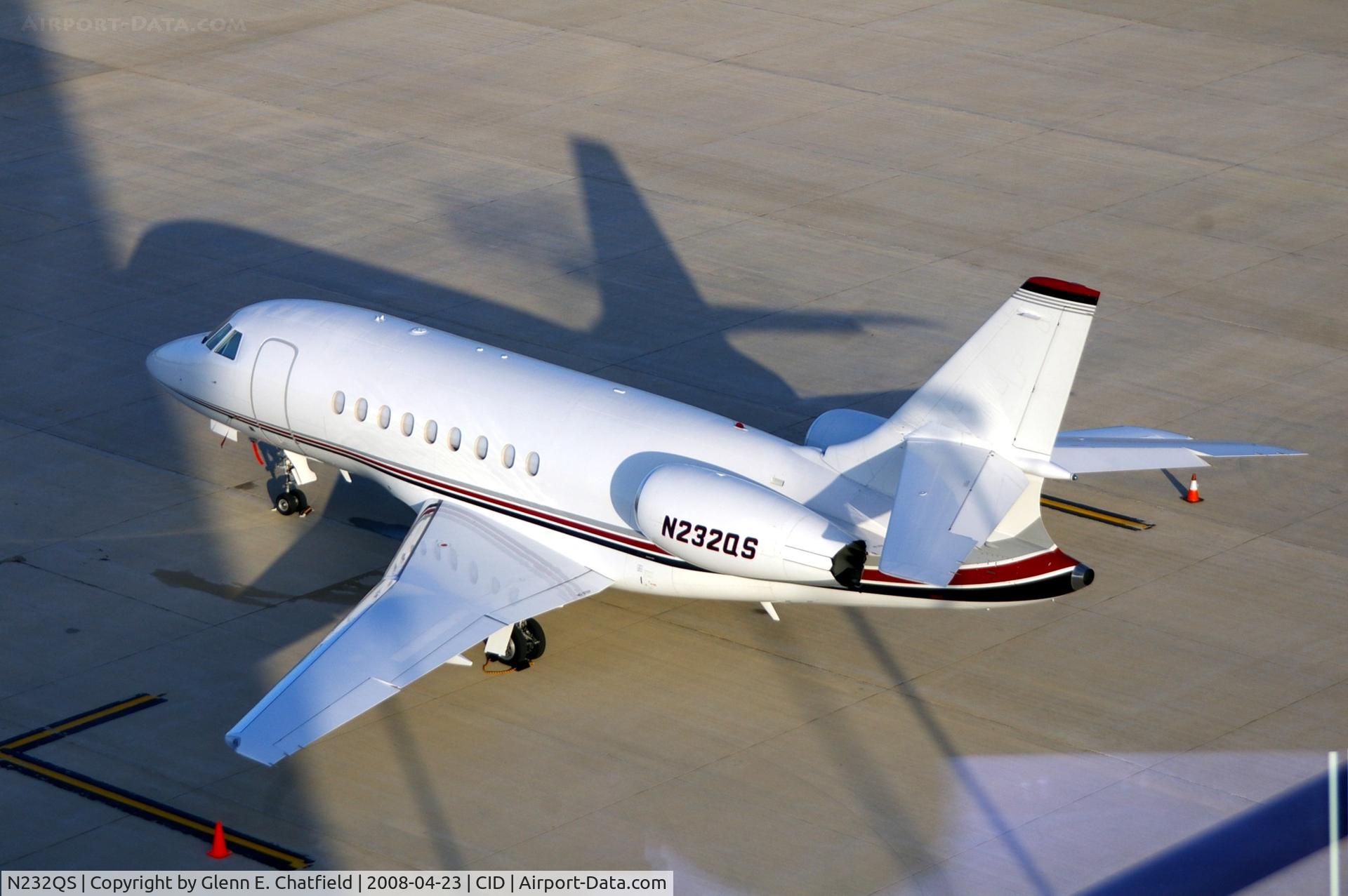 N232QS, 2007 Dassault Falcon 2000EX C/N 115, Looking down from the control tower in the early morning sun, tower shadow across the front of the plane