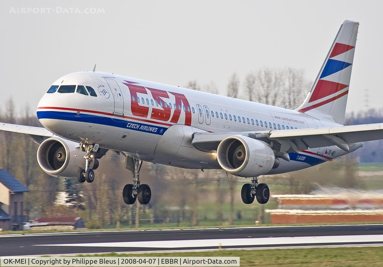 OK-MEI, 2007 Airbus A320-214 C/N 3060, In that magic moment just preceeding touchdown on rwy 25L. Poor light conditions just before sunset.