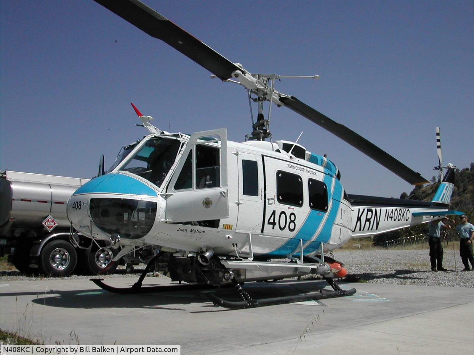 N408KC, 1967 Bell UH-1H Iroquois C/N 9923, 408 receiving some fuel at Keene Helibase