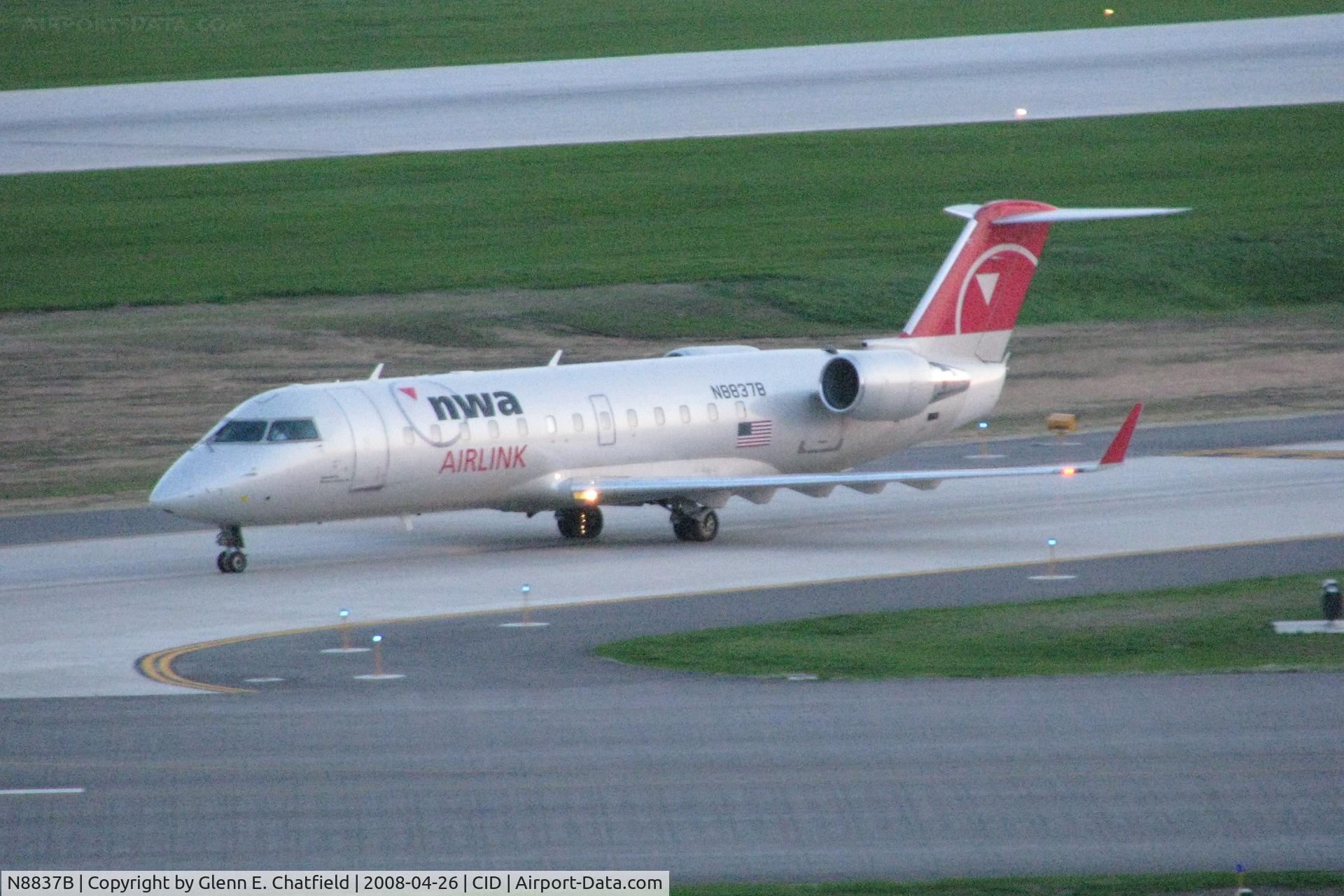 N8837B, 2003 Bombardier CRJ-200 (CL-600-2B19) C/N 7837, Approaching runway 13/31 on Alpha after sunset