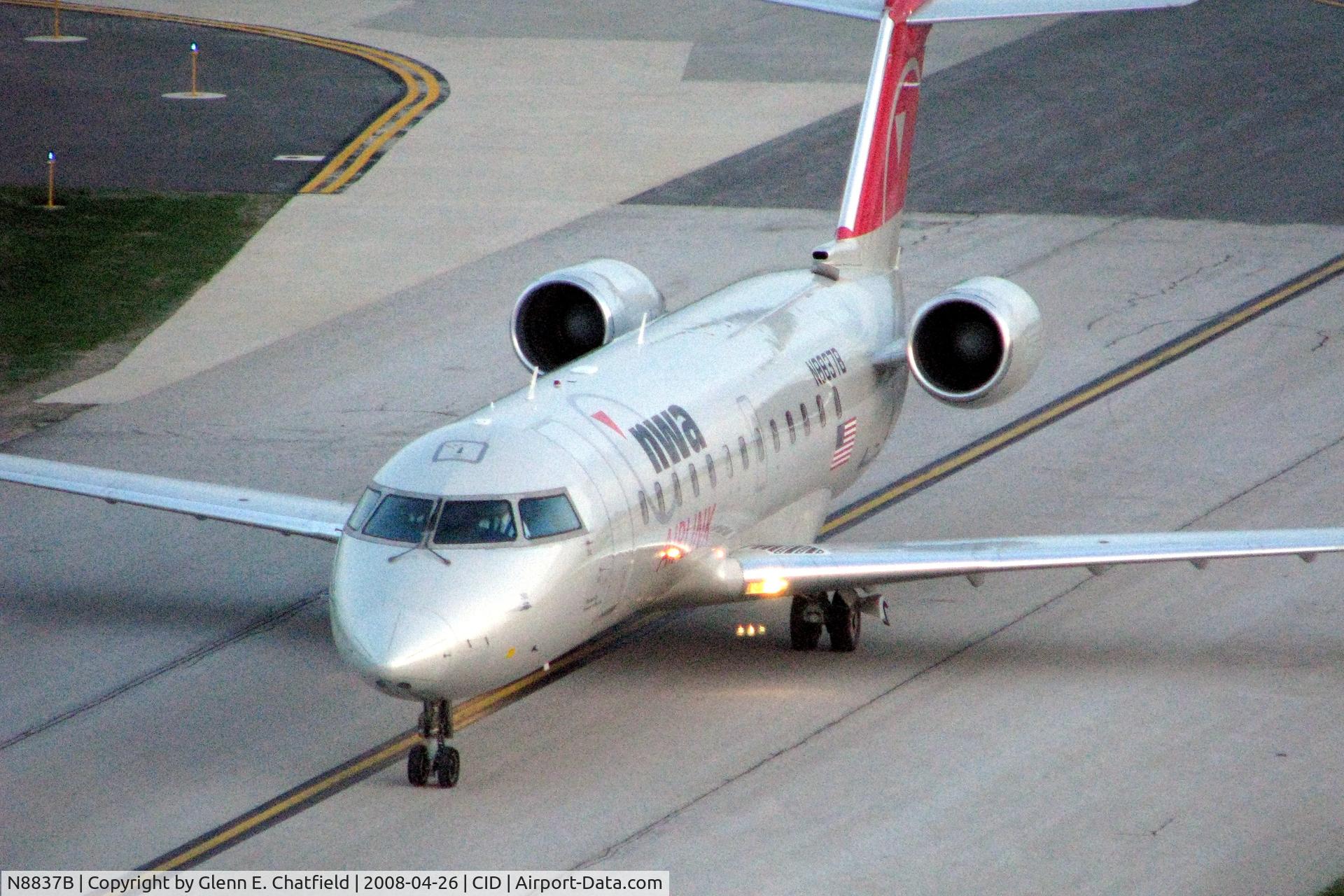 N8837B, 2003 Bombardier CRJ-200 (CL-600-2B19) C/N 7837, On Alpha 4 below the tower after sunset