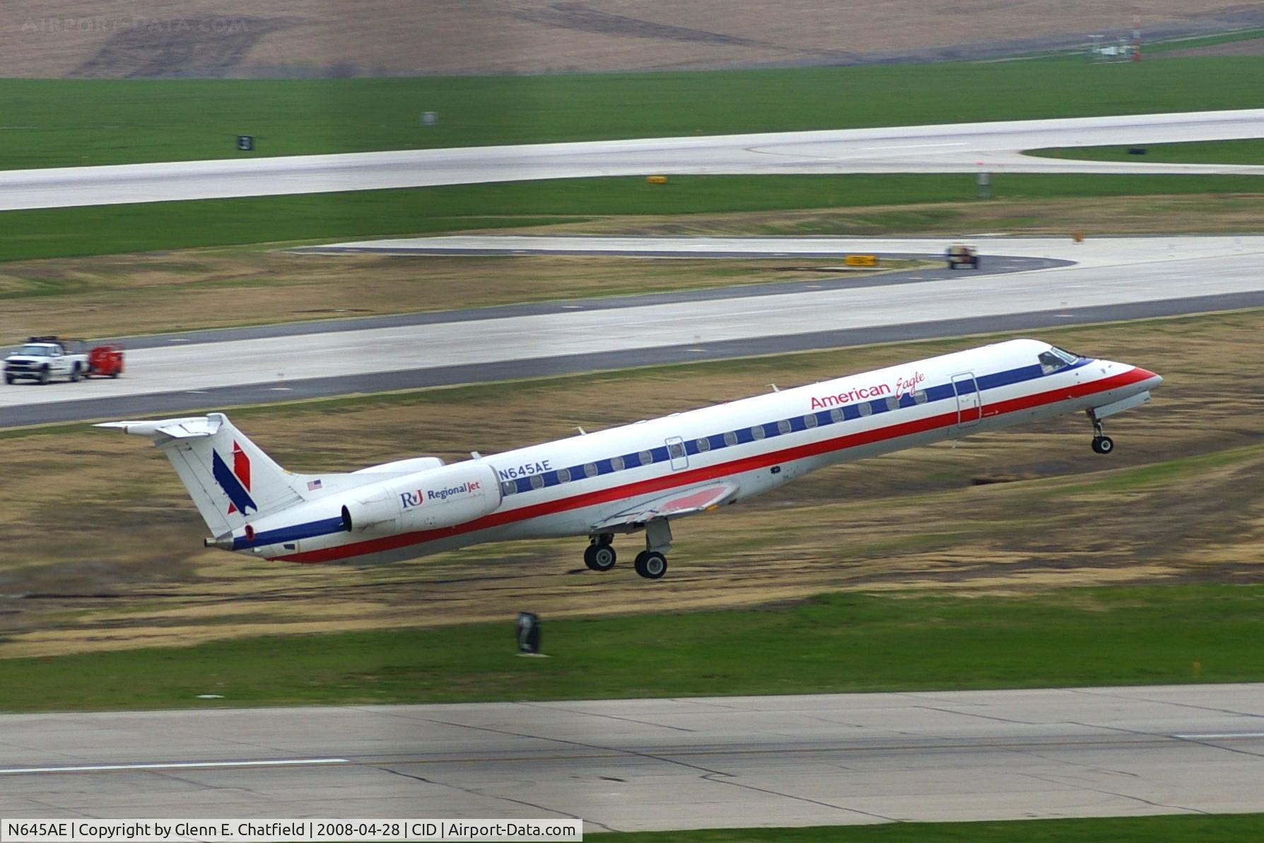 N645AE, 2000 Embraer ERJ-145LR (EMB-145LR) C/N 145212, Departing Runway 31, curtain cord got in the way
