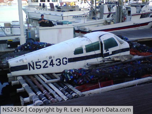 N5243G, 1961 Cessna 310E C/N 310M0021, Sitting on a small barge in Long Beach, CA