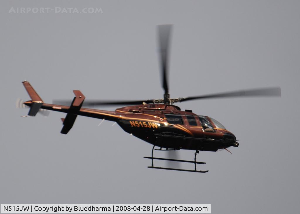 N515JW, 2006 Bell 407 C/N 53693, Flying East over Columbine Highschool in formation with helicopter N83700
