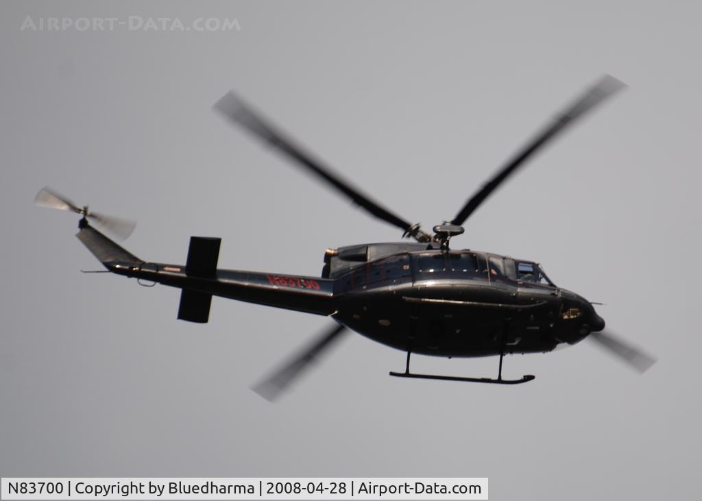N83700, 1998 Bell 412 C/N 36208, Flying East over Columbine Highschool in formation with helicopter N515JW.