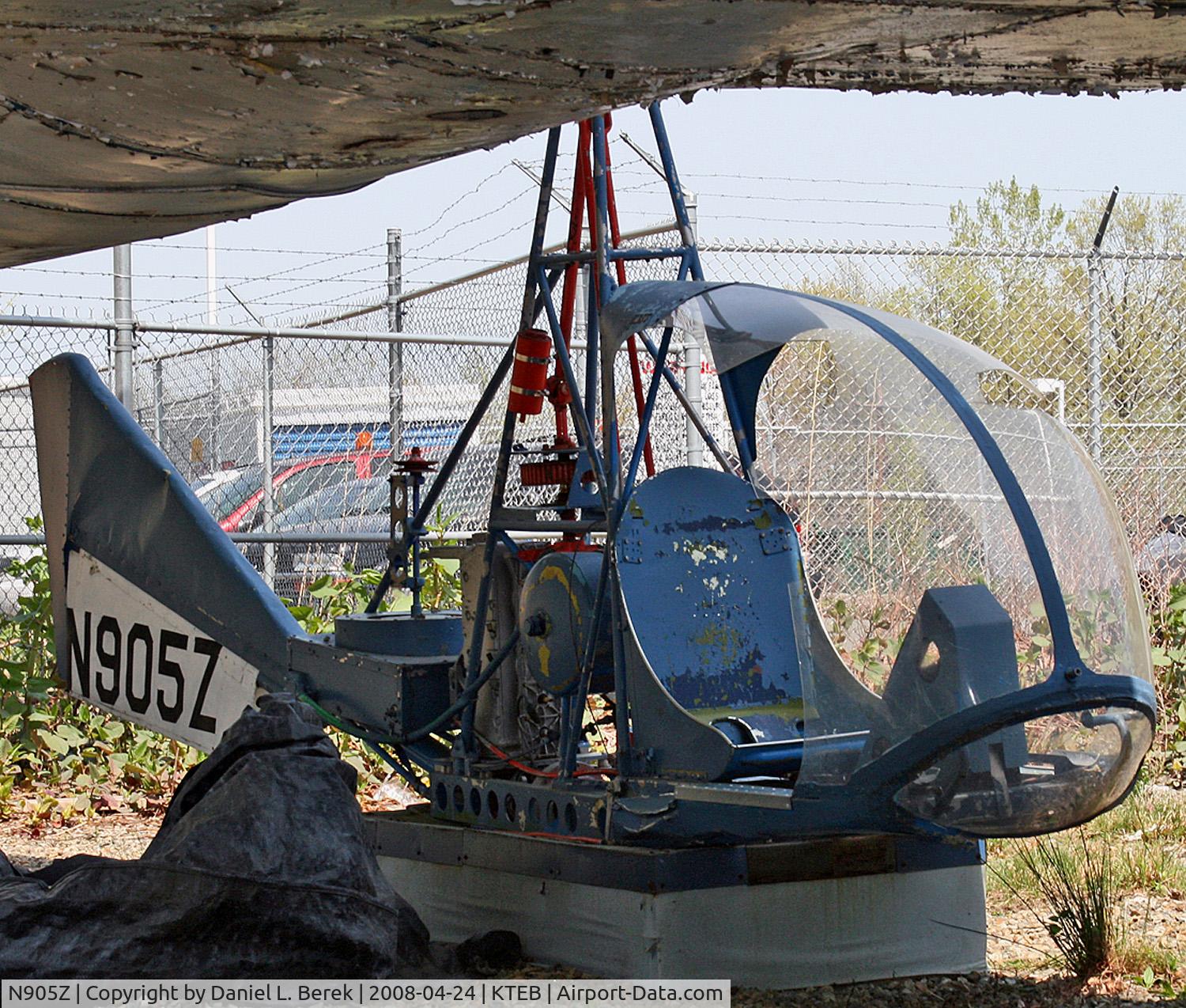 N905Z, 1962 Snyder R-1 C/N 1, This highly unusual experimental rotorcraft, built in 1962, is framed by the peeling underbelly of a Martin 202 at the Aviation Hall of Fame of New Jersey.