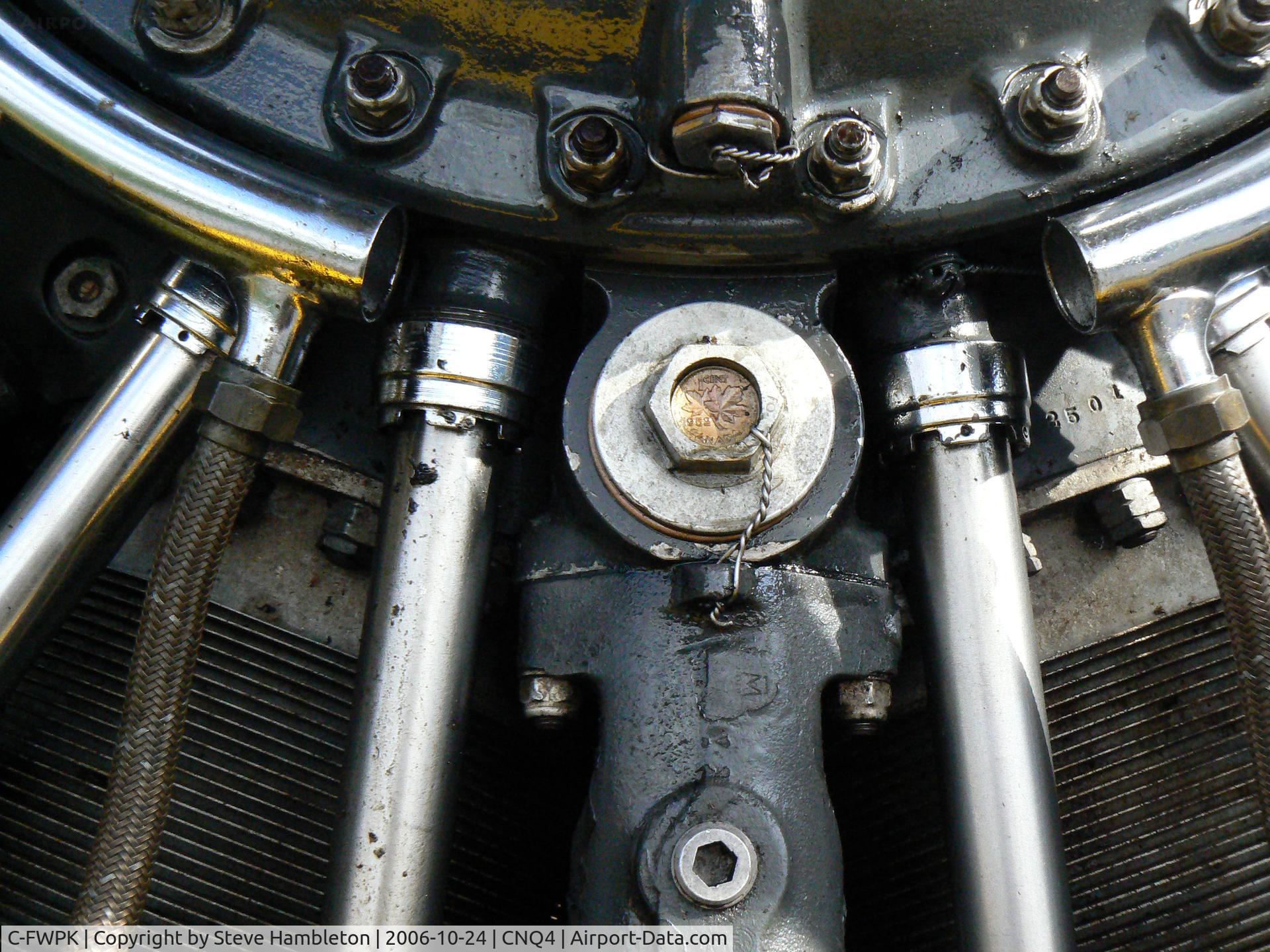 C-FWPK, 1952 Canadian Car & Foundry T-6 Harvard Mk.4 C/N CCF4-33, A 1 cent coin of the year of manufacture is embedded in the engine of Harvards
