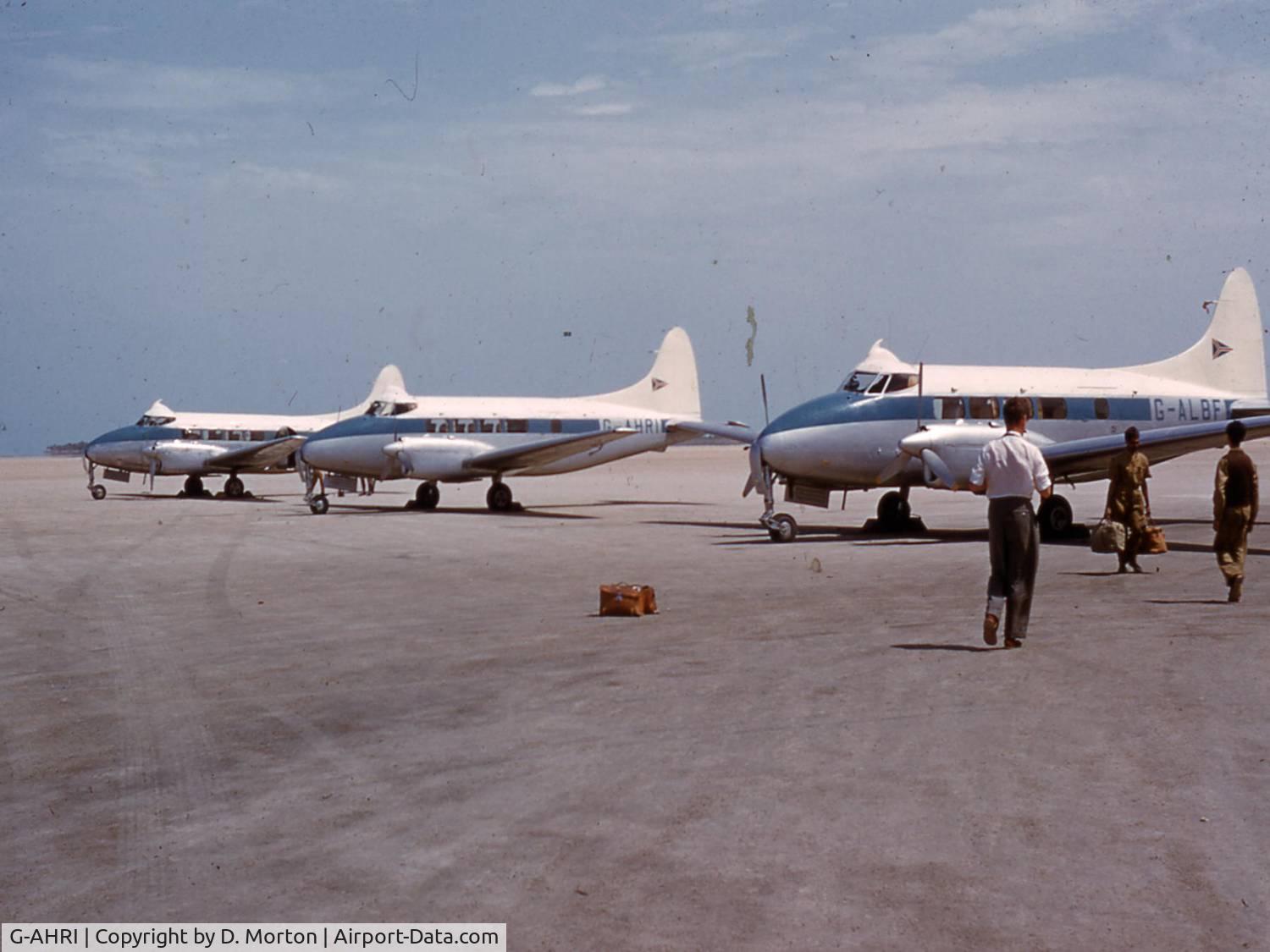 G-AHRI, 1946 De Havilland DH-104 Dove 1B C/N 04008, G-AHRI between two other Doves of the Iraq Petroleum Transport Company, Persian Gulf, circa 1954