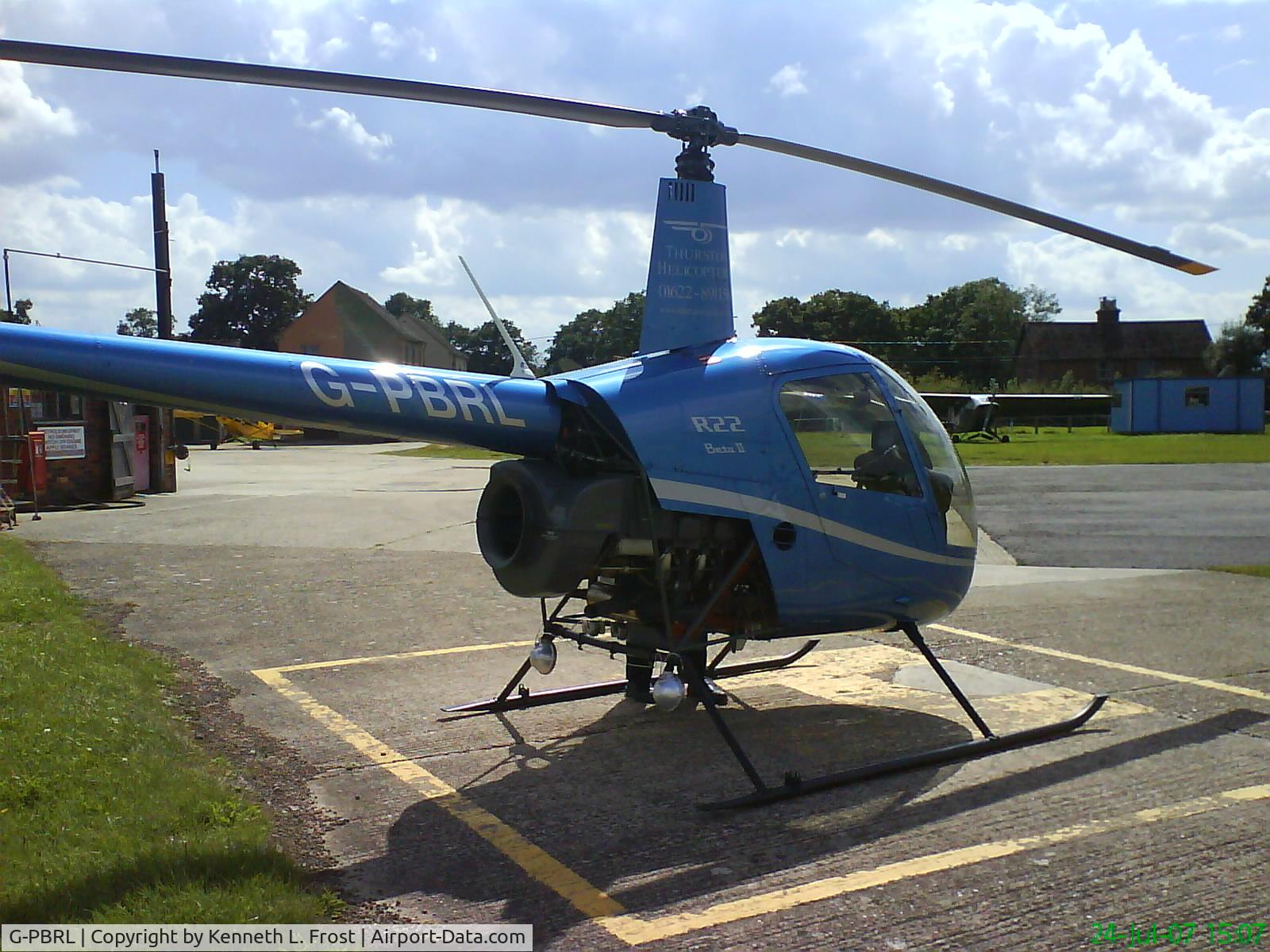 G-PBRL, 2006 Robinson R22 Beta II C/N 4053, G-PBRL on a helipad at Headcorn Airport, Kent, England
