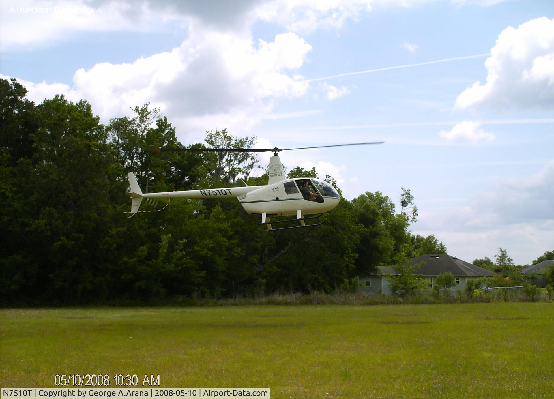 N7510T, 2006 Robinson R44 C/N 1563, Giving joyrides to visitors at the Santa Fe Community College