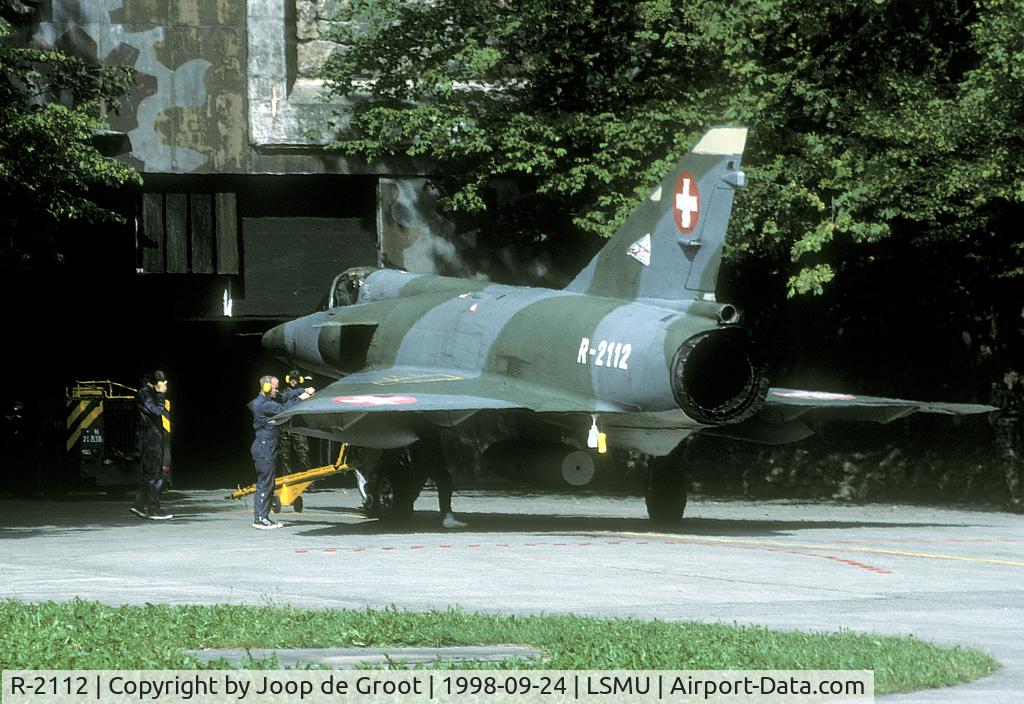 R-2112, Dassault Mirage IIIRS C/N 1035, Switzerland is one of few coutries that uses mountain hangars. This Mirage is about to switch off its engine. It will be towed inside the mountain afterwards.