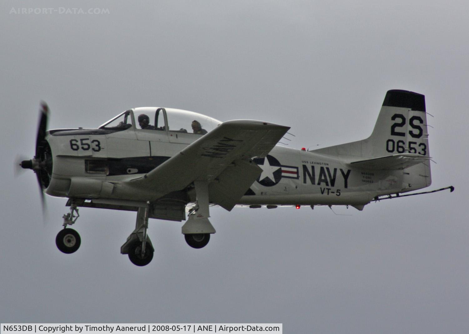 N653DB, 1957 North American T-28C Trojan Trojan C/N 226-230, Returning from the Minnesota State Capital Fly-Over. Website for the guy in the back seat listed below.