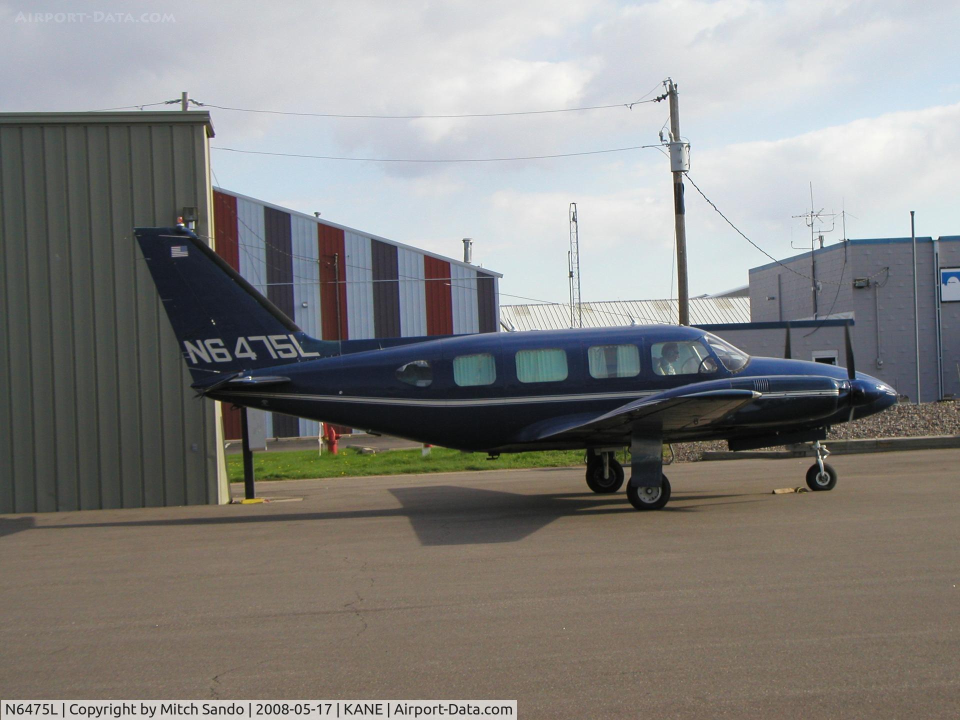 N6475L, 1969 Piper PA-31-310 Navajo C/N 31-436, Starting up on the ramp at Cirrus Flight Operations.