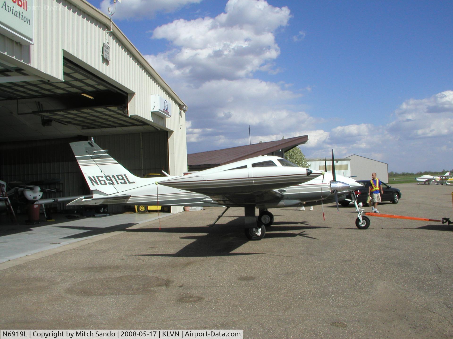 N6919L, 1965 Cessna 310K C/N 310K0019, Getting towed out of the maintenance hangar to run-up the engines.