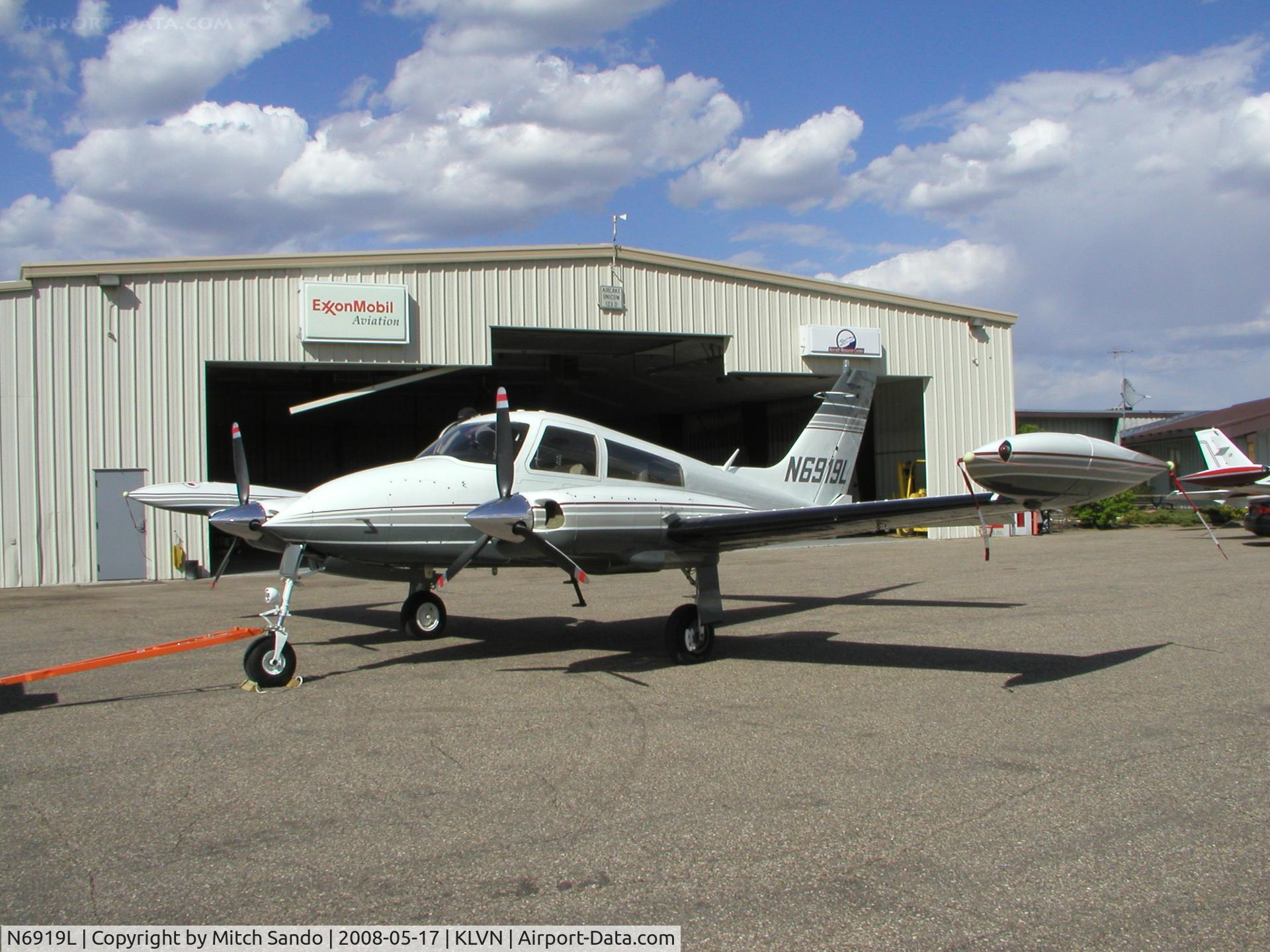 N6919L, 1965 Cessna 310K C/N 310K0019, Getting towed out of the maintenance hangar to run-up the engines.