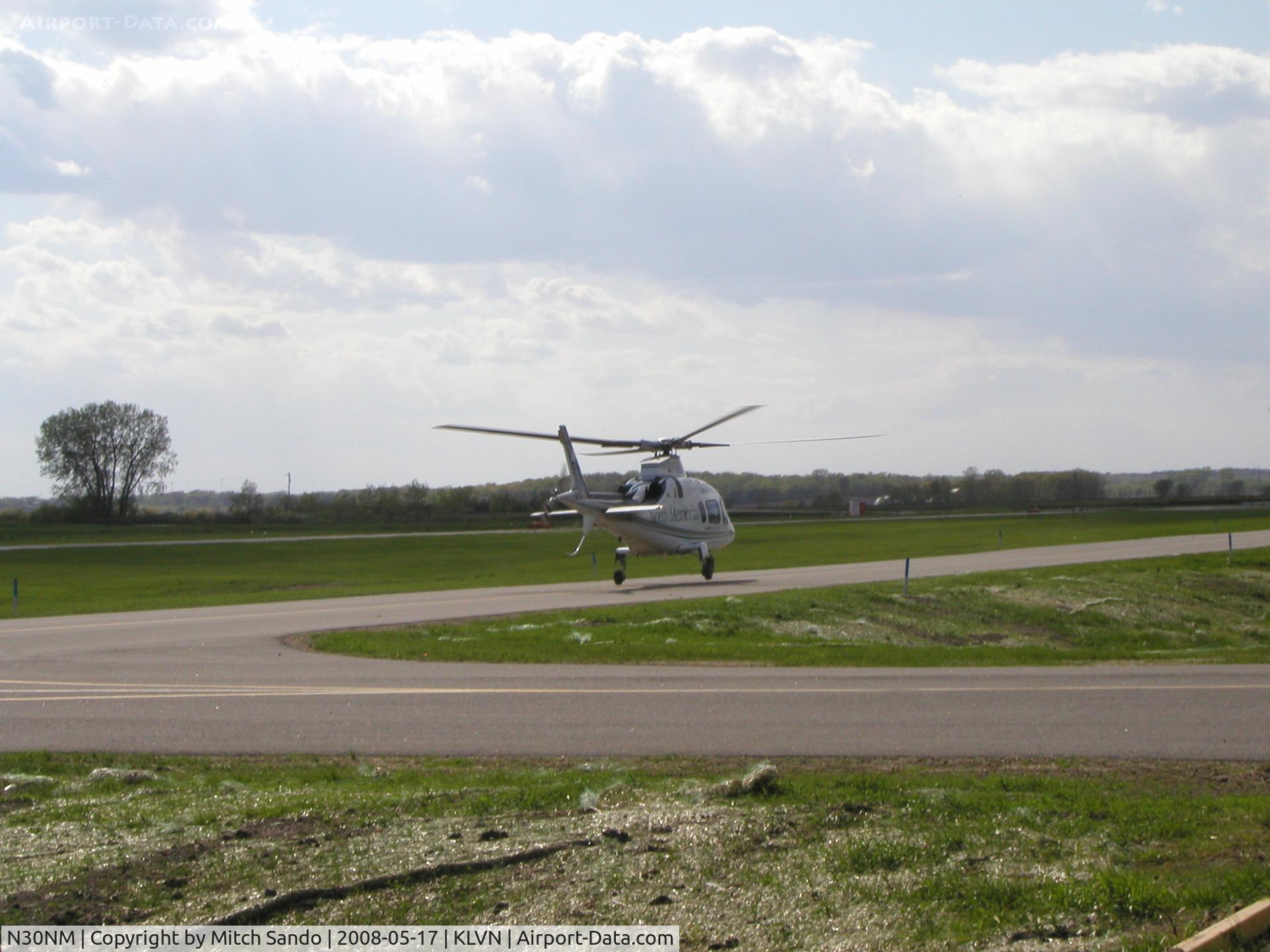 N30NM, Agusta A-109E Power C/N 11065, Departing the parallel taxiway to Runway 30 VFR to Brainerd, MN (BRD).