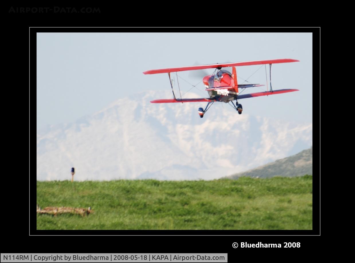 N114RM, 1999 Aviat Pitts S-2C Special C/N 6030, Pitts on approach to 17L. Pikes Peak in the background.