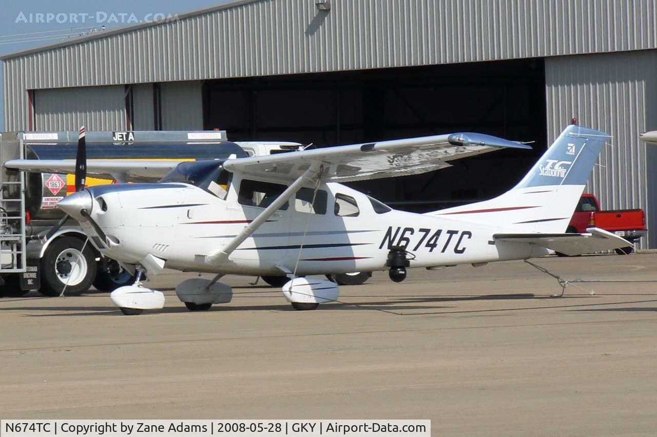N674TC, 2003 Cessna T206H Turbo Stationair C/N T20608380, At Arlington Municipal - Notice camera on left side.