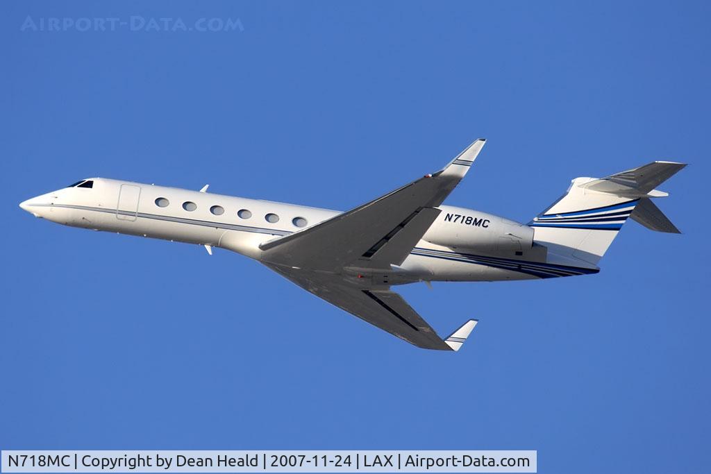 N718MC, 2004 Gulfstream Aerospace G-V C/N 5061, Radical Ventures LLC 2004 Gulfstream G-V N718MC climbing out from RWY 25L. The plane actually belongs to Mark Cuban, owner of the Dallas Mavericks, thus the MC in the tail number.