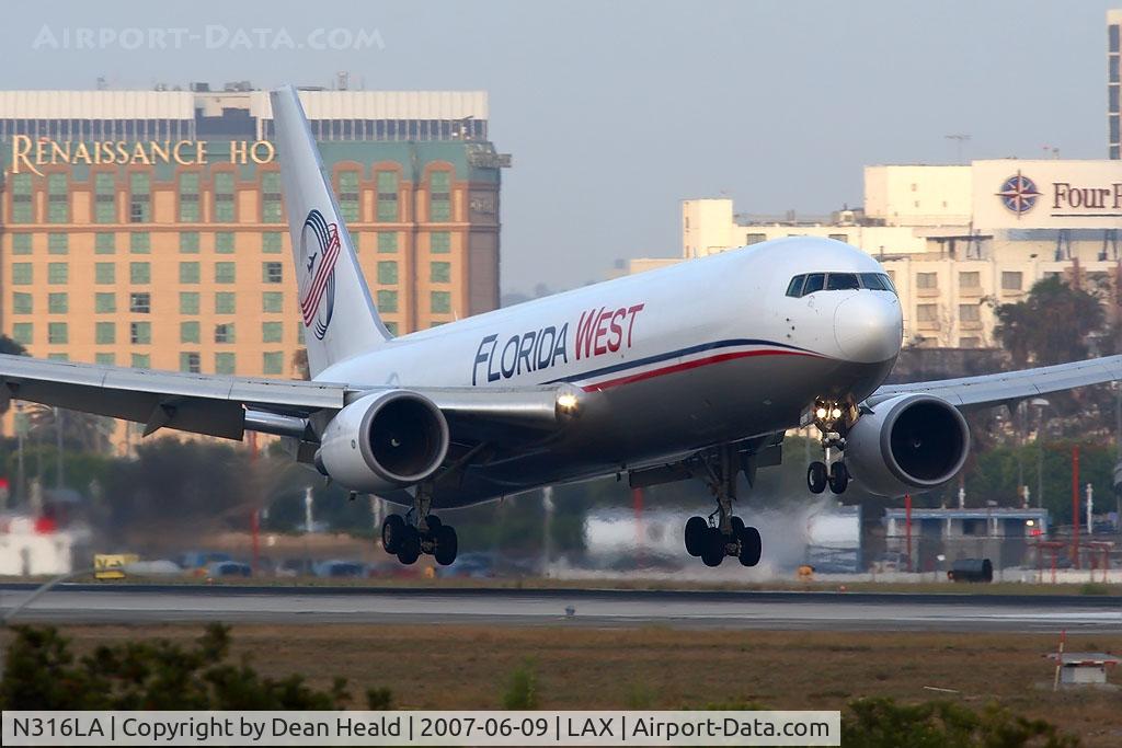 N316LA, 2001 Boeing 767-316F C/N 30842, Florida West International Airways N316LA (FLT 770) arriving on RWY 24R from Miami Int'l (KMIA) late in the day.