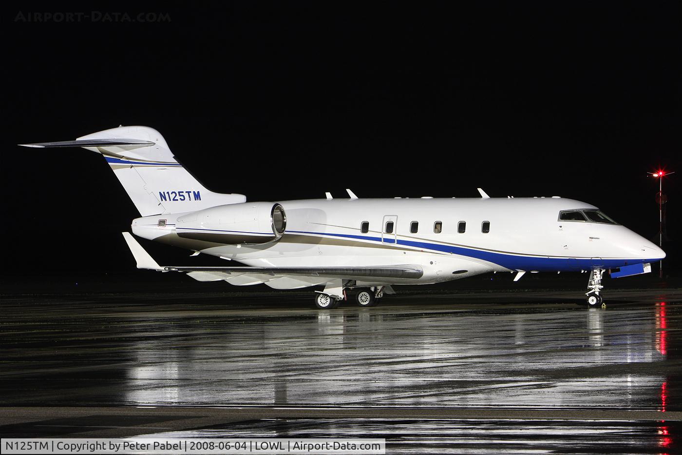 N125TM, 2006 Bombardier Challenger 300 (BD-100-1A10) C/N 20104, nightshot with reflection