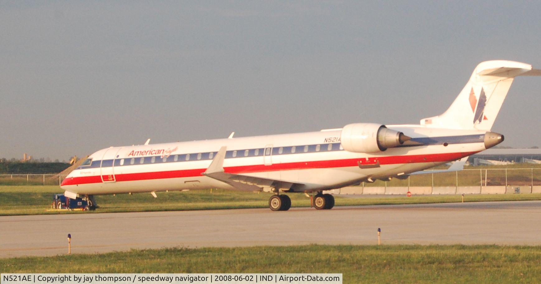 N521AE, 2004 Bombardier CRJ-701 (CL-600-2C10) Regional Jet C/N 10142, Stuck in the grass