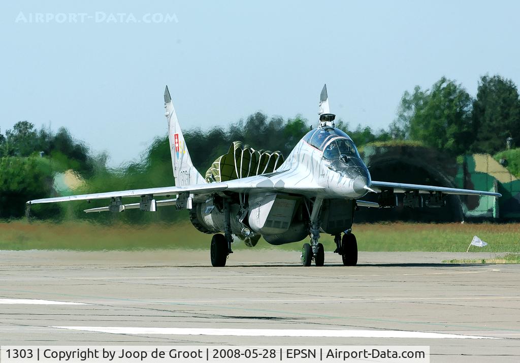 1303, Mikoyan-Gurevich MiG-29UB C/N N50903028113, This tiger coloured MiG-29 taxies in after landing. Note the dragchute still deployed.