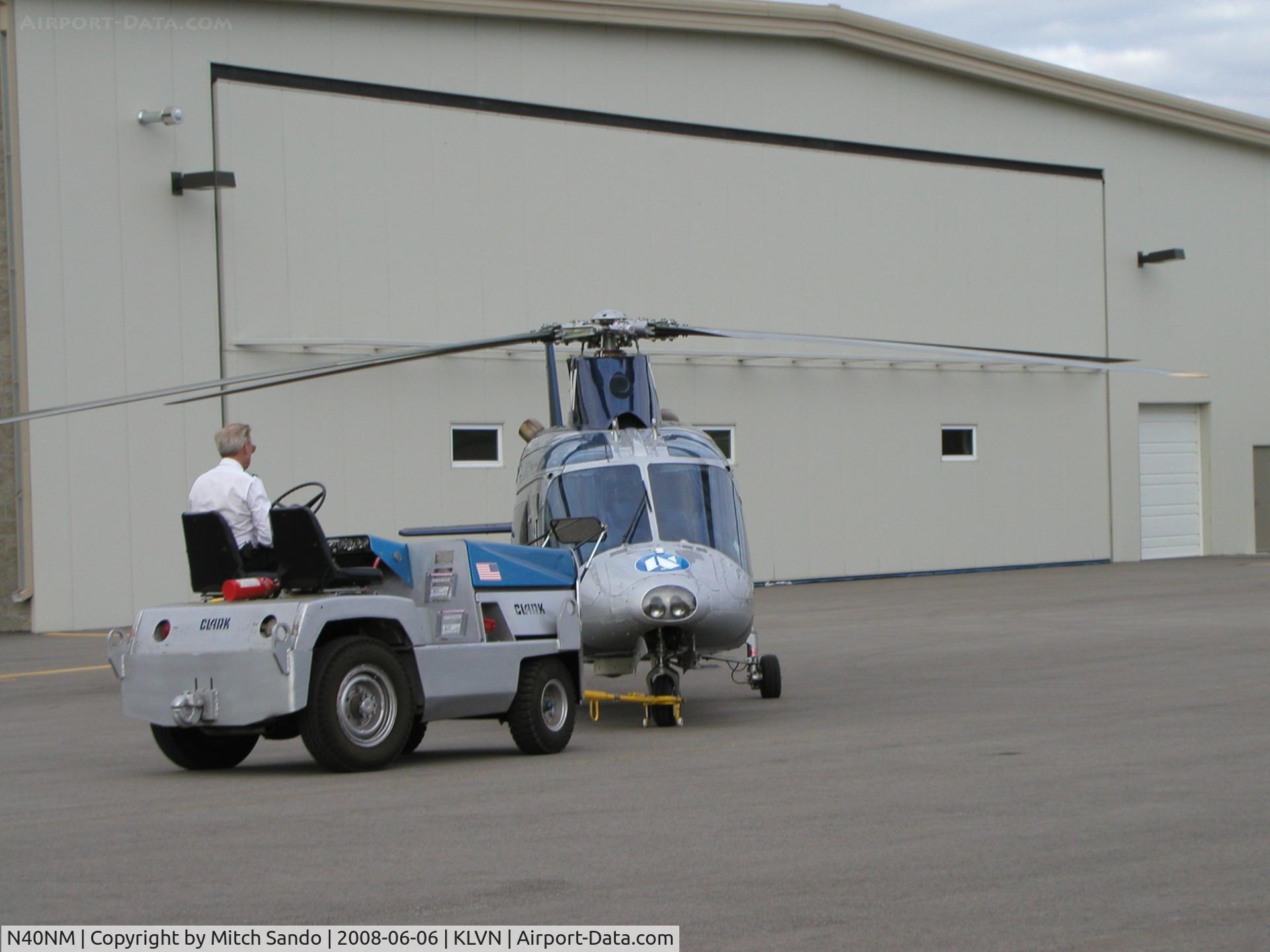 N40NM, 1987 Agusta A109A II C/N 7395, Air Care 1 getting pushed back into the hangar.
