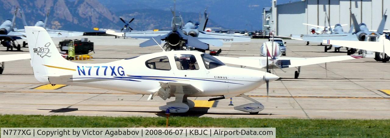 N777XG, 2004 Cirrus SR20 C/N 1428, Ar JeffCo Open House. With nice militaries behind